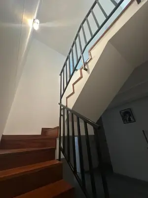 a staircase in a house with a light on the ceiling at Luxury Duplex on the 15th Floor with Terrace in Lima