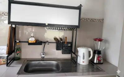 a kitchen counter with a sink and a mixer at Casa de campo El paraiso cerca a Lima in Nuevo Imperial