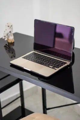a laptop computer sitting on top of a table at Huaral House Piscina y Terraza in Huaral