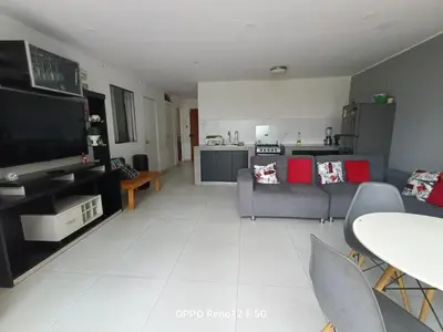 a living room with a couch and a tv at Casasol in Santa Rosa