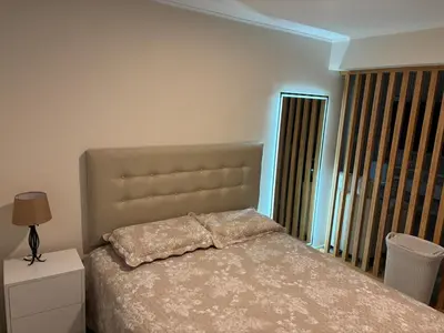a bedroom with a bed with a pillow on it at Apartment in San Miguel De Estreno in Lima