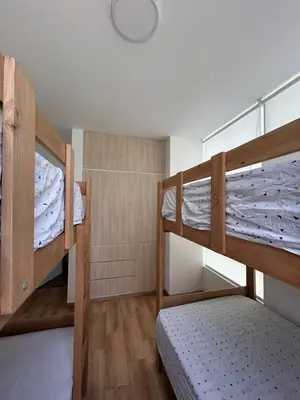 a room with two bunk beds and a lamp at Beach House in Asia, Santorini Condominio in Asia