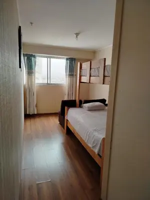 a bedroom with a bed and a large window at Departamento Executive 2BR Balcón Frente al Mall Santa Catalina in Lima