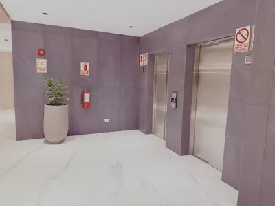 a hallway with a potted plant in a building at Brand new apartment in the heart of Miraflores in Lima
