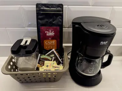 a counter with a coffee maker and a basket of food at Brand new apartment in the heart of Miraflores in Lima