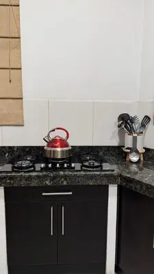 a tea kettle sitting on top of a stove in a kitchen at Casa de Campo Las Siete Gotas - Cieneguilla in Cieneguilla