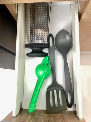 a drawer filled with kitchen utensils in a box at Private cinema & comfort in cultural Barranco in Lima