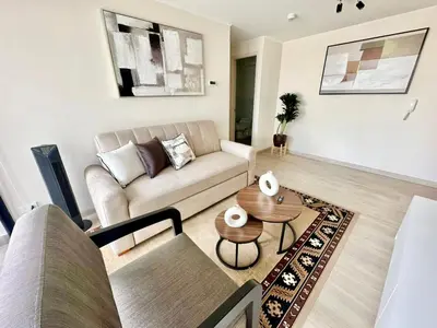 a living room with a couch and a table at Apartment in the center of Miraflores Larco in Lima