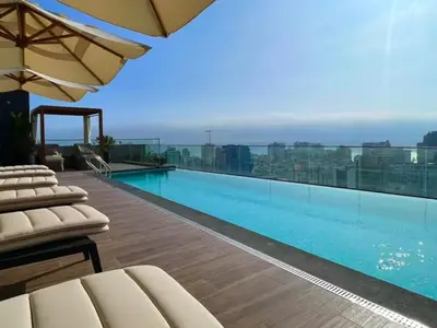 a large swimming pool on top of a building at Apartment in the center of Miraflores Larco in Lima