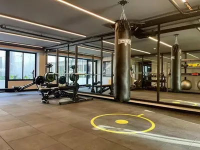 a gym with a large punching bag and a gym with weights at Apartment in the center of Miraflores Larco in Lima