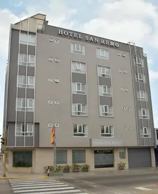 a hotel san ignacio building on the corner of a street at Hotel San Remo in Lima