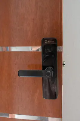 a door with a cell phone sticking out of it at Apart Hotel Alojate Kaypi in Ayacucho