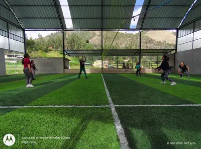 a group of people playing soccer on a soccer field at Nuevo campo verde eirl in Lima