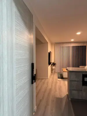 an open door to a kitchen and a living room at Amalfi Apartment 612 Malecón de la Avenida Costanera in Lima
