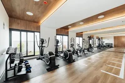 a gym with treadmills and elliptical machines at Amalfi Apartment 612 Malecón de la Avenida Costanera in Lima