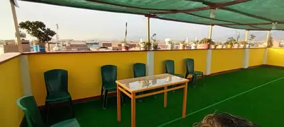 a room with a table and chairs on a roof at Private Apartment Close to Airport - Airport Shuttle Available in Lima