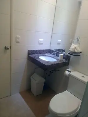 a bathroom with a sink and a toilet at Coliving Barranco in Lima