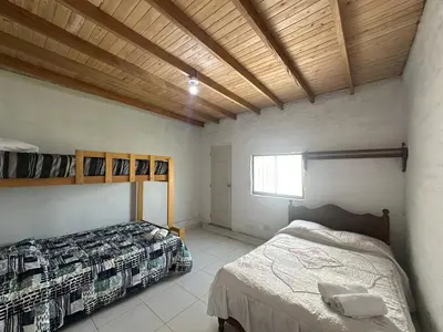 a bedroom with two beds and a window at Casita de Campo y Relax con Piscina in Cerro Azul