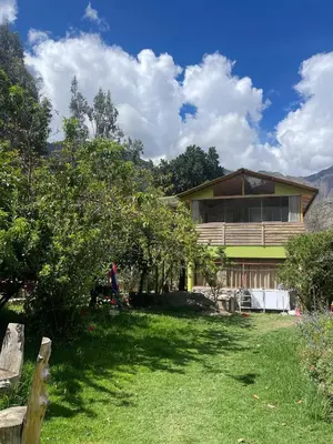 a house with a yard in front of it at Casa llegada del Sol in Ollantaytambo
