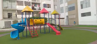 a playground with a slide in a building at Departamento 4p en condominio Centro de Lima in Lima