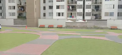 a walkway in a park with benches and buildings at Departamento 4p en condominio Centro de Lima in Lima