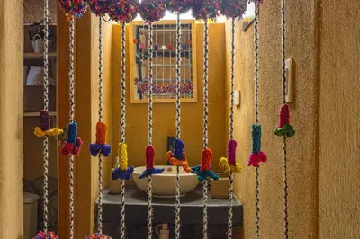 a room with a bunch of beads hanging on a wall at Alpine Cabin Quito in Cusco