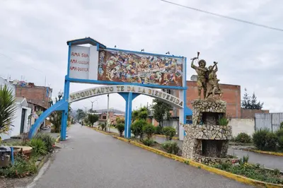 a building with a mural on the side of a street at Posada El Pino