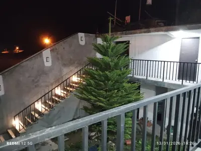 a christmas tree on the balcony of a building at Posada El Pino