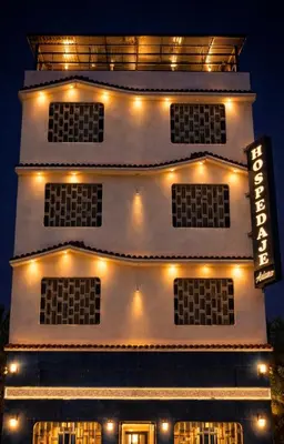a building with lights on the side of it at Hospedaje Ariana in Supe