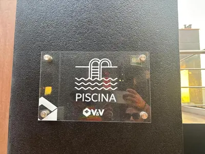a sign on a wall with a picture of a door at Apartment in Larco - Miraflores in Lima