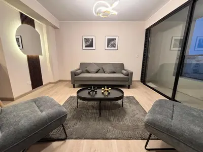 a living room with a couch and a table at Apartment in Larco - Miraflores in Lima