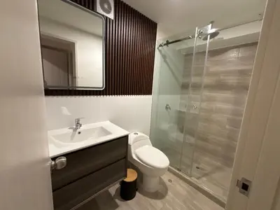 a bathroom with a sink and a toilet and a shower at Apartment in Larco - Miraflores in Lima