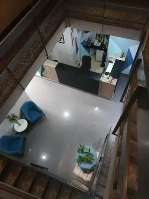 an overhead view of a room with a table and chairs at HOTEL Regency Plaza in Pisco