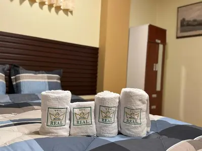 a group of three towels on a bed at Gran Hotel Real in Huancayo