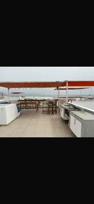 a large room with a table and a tableasteryasteryasteryasteryasteryasteryastery at Beach House - Condominio Asia Bonita in Asia