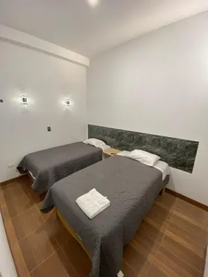 a room with two beds in a room at Ocean Home in San Juan de Marcona