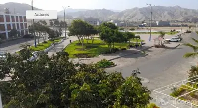 a view of a street with trees and a building at Tiki in San Bartolo