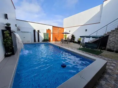 a swimming pool in the backyard of a house at Casa Bujama Playa y Piscina Privada in Bujama Baja