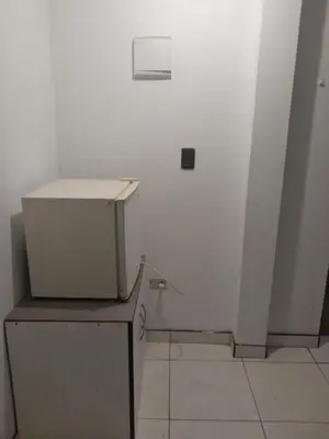 a white room with a white wall and a box at Minidepa San Bartolo in San Bartolo