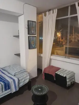 a bedroom with a bed and a window at Minidepa San Bartolo in San Bartolo