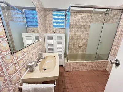 a bathroom with a sink and a shower at Miraflores kennedy view in Lima