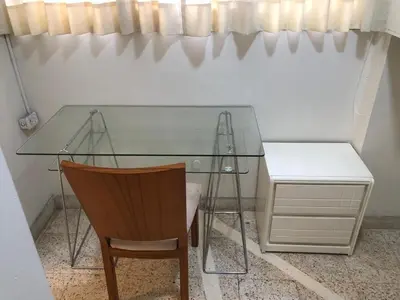 a glass table and a chair and a desk at Miraflores kennedy view in Lima
