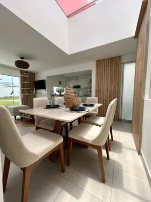 a dining room with a table and chairs at Casa de Playa en Puerto Viejo, Condominio Kalua in San Antonio