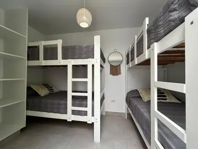 two bunk beds in a small room with at Casa de Playa en Puerto Viejo, Condominio Kalua in San Antonio