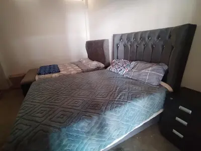 a bedroom with a bed with a headboard at Finca Lucía Kemper in San Vicente de Cañete