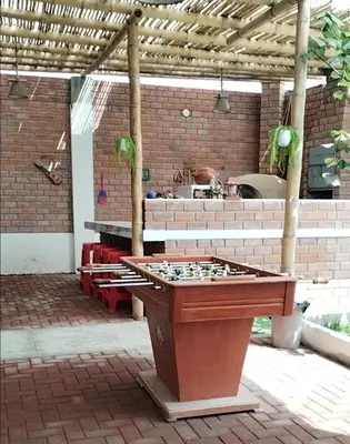a ping pong table in the middle of a patio at Finca Lucía Kemper in San Vicente de Cañete