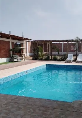 a swimming pool in front of a house at Finca Lucía Kemper in San Vicente de Cañete