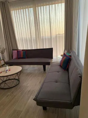 a living room with a couch and a table at Topará Beach House in San Vicente de Cañete