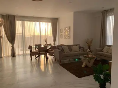a living room with a couch and a table at Topará Beach House in San Vicente de Cañete