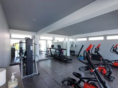 a gym with several treadmills and exercise bikes at Casa de playa Cala del Mar Experience in Bujama Baja